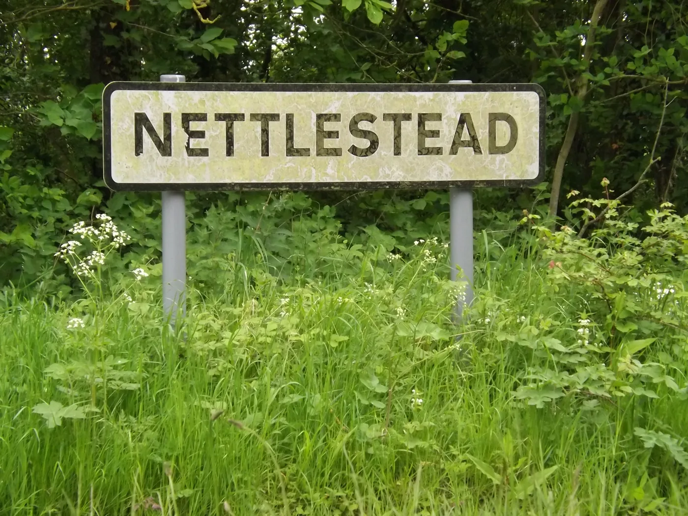 The Nettlestead village sign on Nettlestead Road. The photograph does not show the property that was searched.